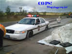 Cops, concrete, workers, roadway